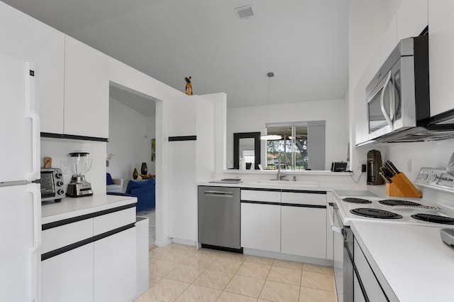 9927 Seacrest Cir Unit 202, Boynton Beach, FL 33437 - kitchen with visible vents, a sink, light countertops, and stainless steel appliances