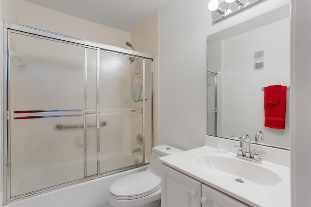 9927 Seacrest Cir Unit 202, Boynton Beach, FL 33437 - bathroom featuring vanity, shower / bath combination with glass door, visible vents, and toilet