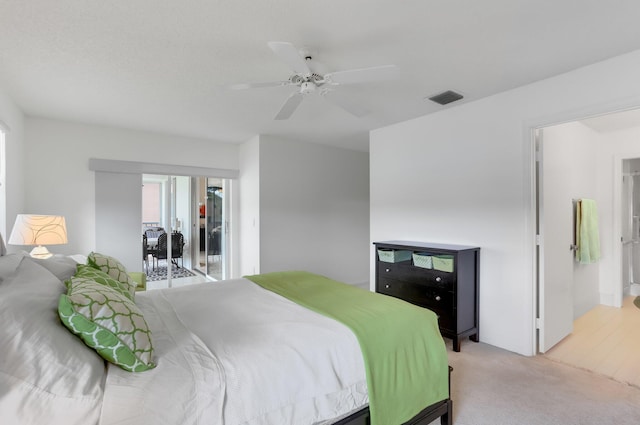 9927 Seacrest Cir Unit 202, Boynton Beach, FL 33437 - bedroom with light colored carpet, a ceiling fan, and visible vents