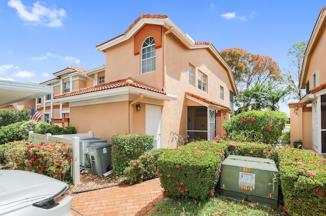 9927 Seacrest Cir Unit 202, Boynton Beach, FL 33437 - view of front of home with stucco siding and a tile roof