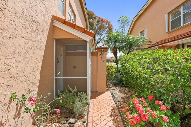 9927 Seacrest Cir Unit 202, Boynton Beach, FL 33437 - view of exterior entry featuring stucco siding