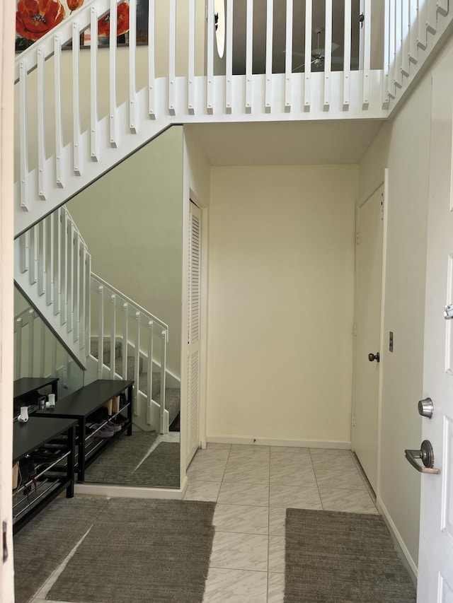 9927 Seacrest Cir Unit 202, Boynton Beach, FL 33437 - entryway with stairs, baseboards, and marble finish floor