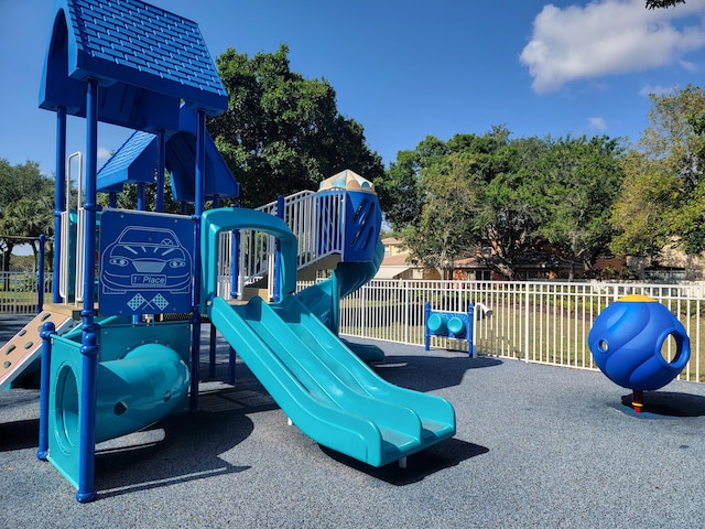 communal playground featuring fence