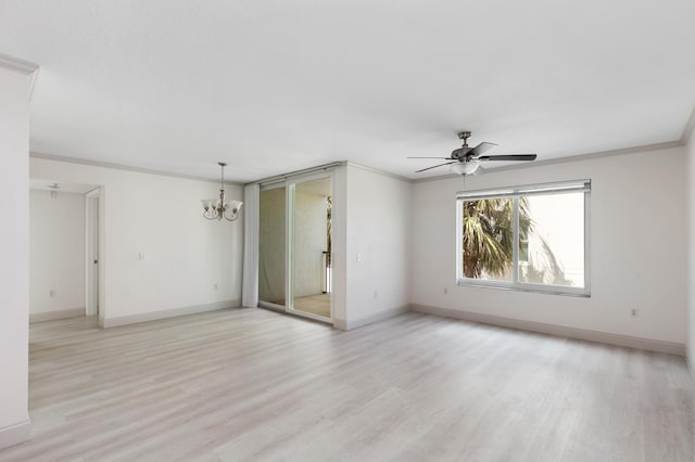empty room featuring ceiling fan with notable chandelier, crown molding, baseboards, and light wood finished floors
