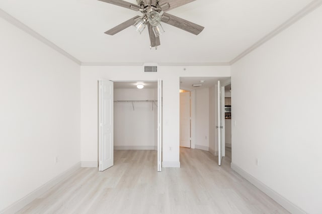 unfurnished bedroom with a closet, light wood-type flooring, baseboards, visible vents, and ornamental molding