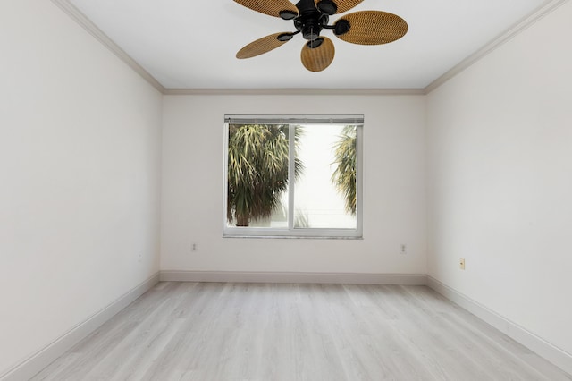 empty room featuring a ceiling fan, crown molding, baseboards, and light wood finished floors