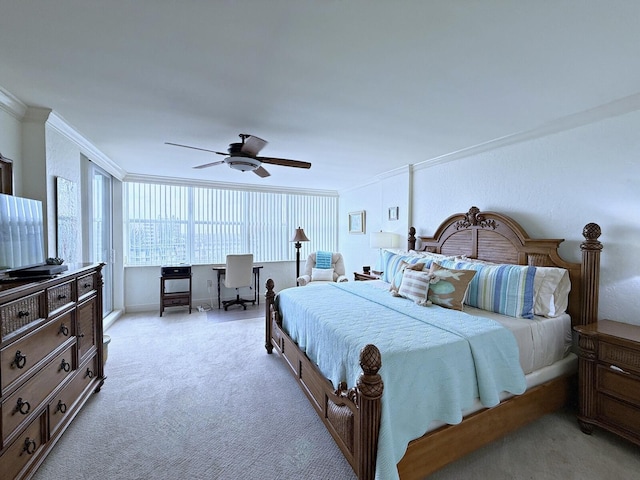 bedroom featuring ceiling fan, light colored carpet, and crown molding
