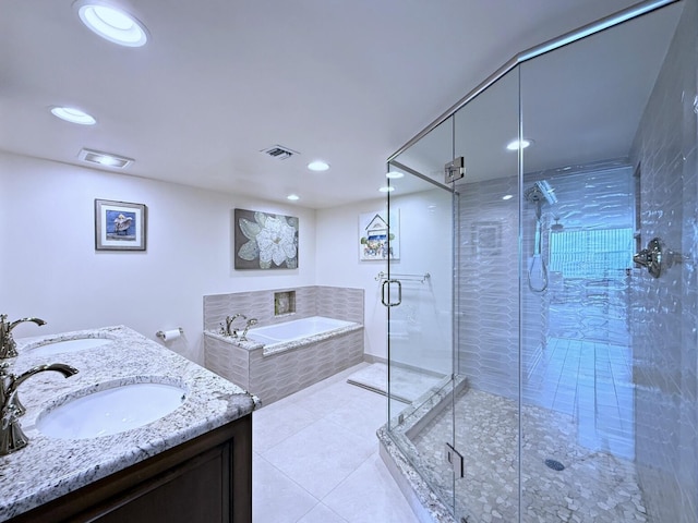 full bath featuring tile patterned floors, visible vents, a bath, and a sink