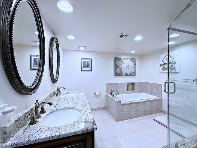 full bathroom with visible vents, baseboards, tile patterned flooring, and a sink