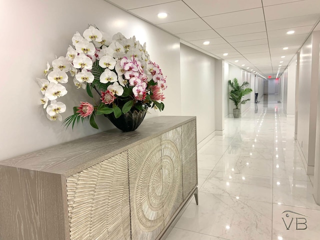 interior space with recessed lighting and marble finish floor