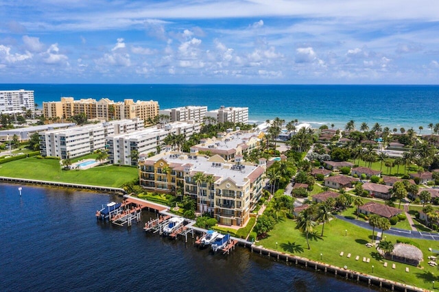birds eye view of property with a water view