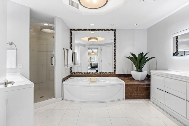 ensuite bathroom with a stall shower, a garden tub, tile patterned flooring, and connected bathroom