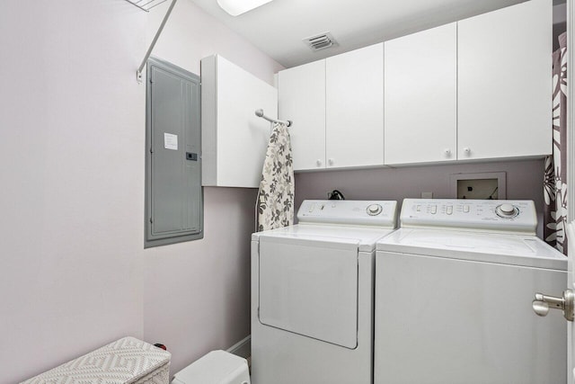 clothes washing area featuring cabinet space, visible vents, washing machine and dryer, and electric panel