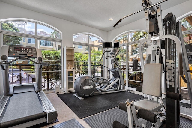 exercise room featuring recessed lighting and carpet floors
