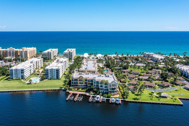 drone / aerial view featuring a water view and a city view