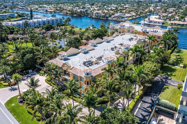 drone / aerial view with a water view and a residential view