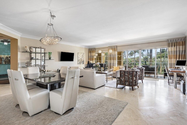dining room featuring crown molding and an inviting chandelier