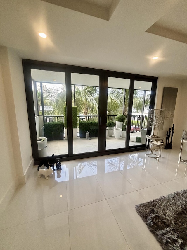 3400 S Ocean Blvd Unit 3H, Highland Beach, FL 33487 - doorway to outside featuring healthy amount of natural light, tile patterned flooring, a wall of windows, and recessed lighting