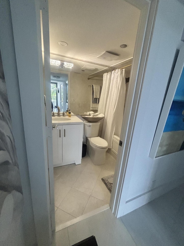 3400 S Ocean Blvd Unit 3H, Highland Beach, FL 33487 - full bathroom featuring vanity, a shower with shower curtain, and tile patterned flooring