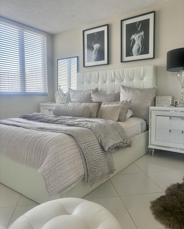 3400 S Ocean Blvd Unit 3H, Highland Beach, FL 33487 - tiled bedroom featuring a textured ceiling