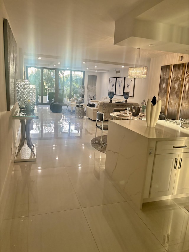 3400 S Ocean Blvd Unit 3H, Highland Beach, FL 33487 - kitchen featuring tile patterned floors, light stone countertops, and open floor plan