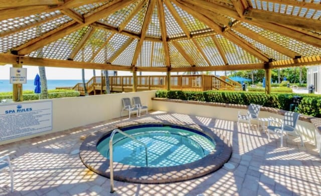3400 S Ocean Blvd Unit 3H, Highland Beach, FL 33487 - view of swimming pool featuring a hot tub and a gazebo