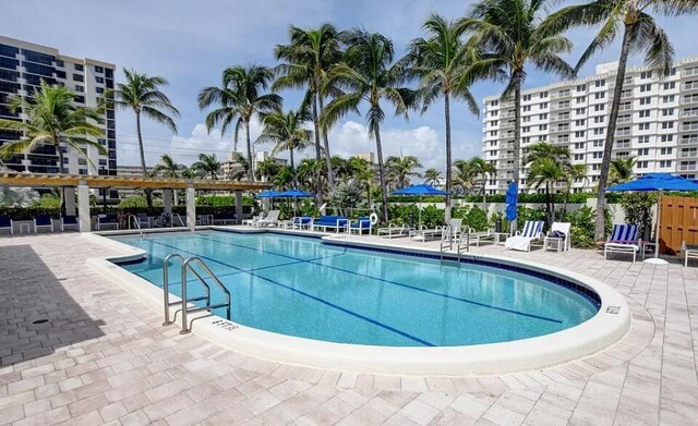 3400 S Ocean Blvd Unit 3H, Highland Beach, FL 33487 - community pool featuring a patio