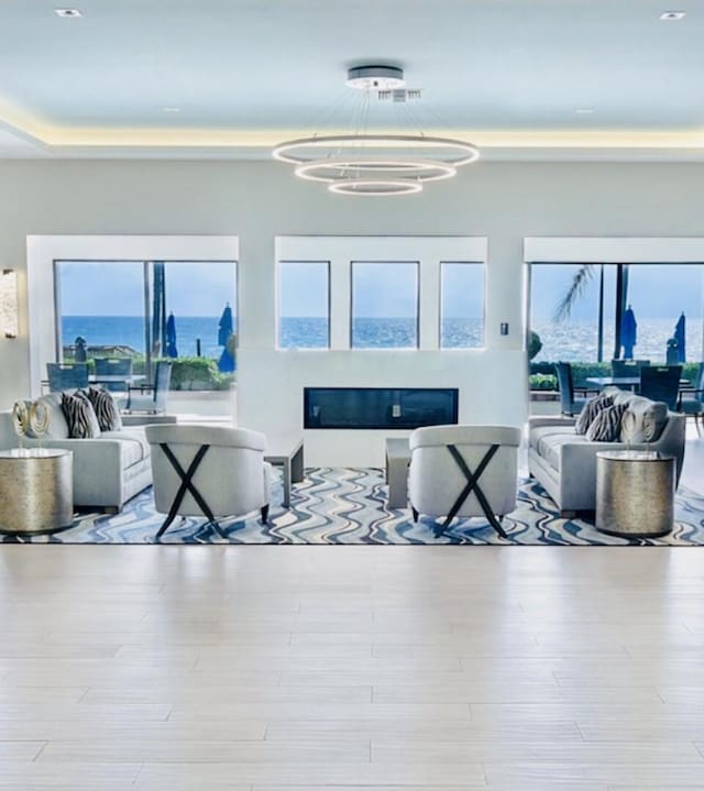3400 S Ocean Blvd Unit 3H, Highland Beach, FL 33487 - living room with a glass covered fireplace and wood finished floors