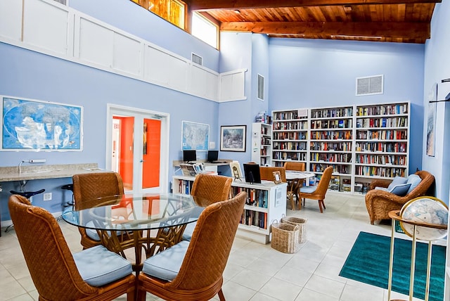 2400 S Ocean Dr Unit 1216, Fort Pierce, FL 34949 - dining area featuring wooden ceiling, light tile patterned flooring, a towering ceiling, and visible vents