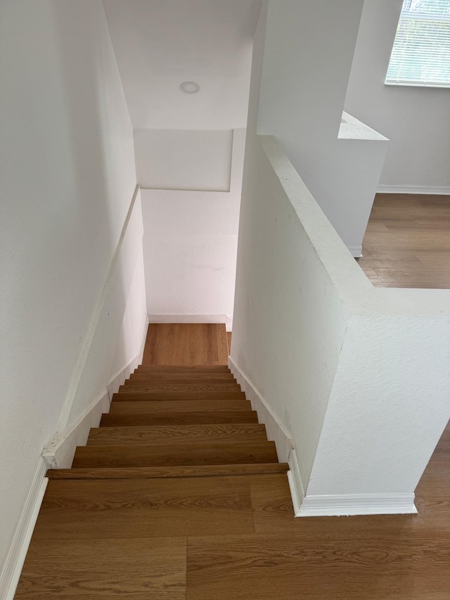 stairs with wood finished floors