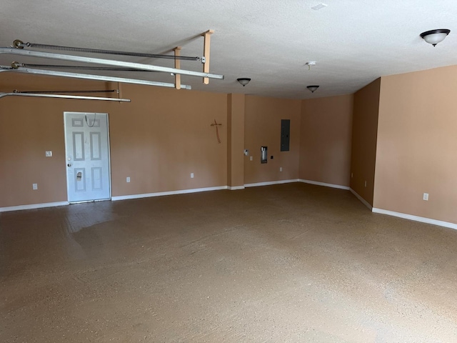 unfurnished room featuring electric panel and baseboards