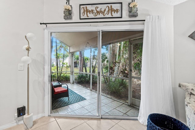 entryway featuring tile patterned floors and baseboards