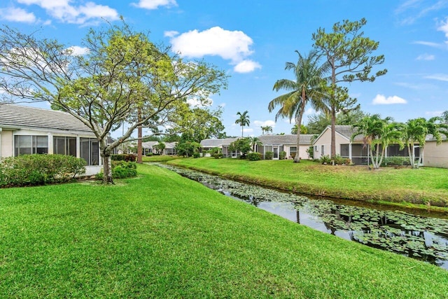 view of yard with a sunroom