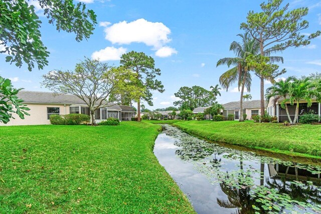 view of property's community featuring a yard