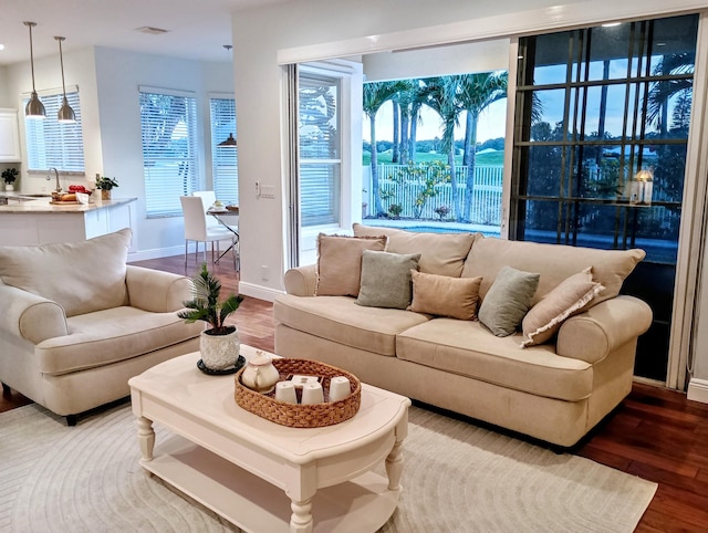 living room featuring baseboards and wood finished floors