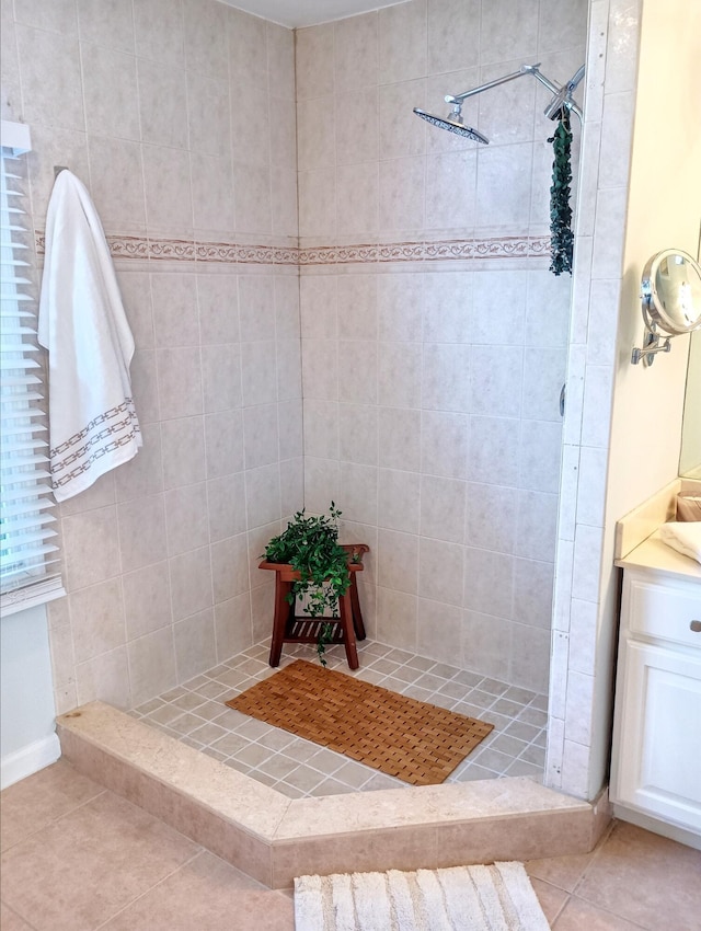 full bath with tile patterned flooring and a shower stall