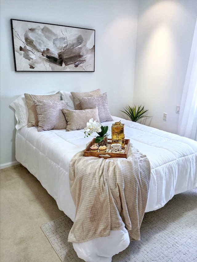 bedroom with baseboards and carpet flooring