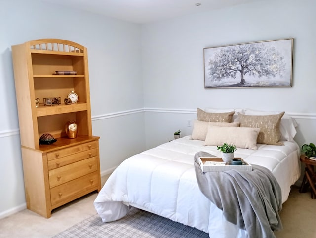 bedroom with light colored carpet