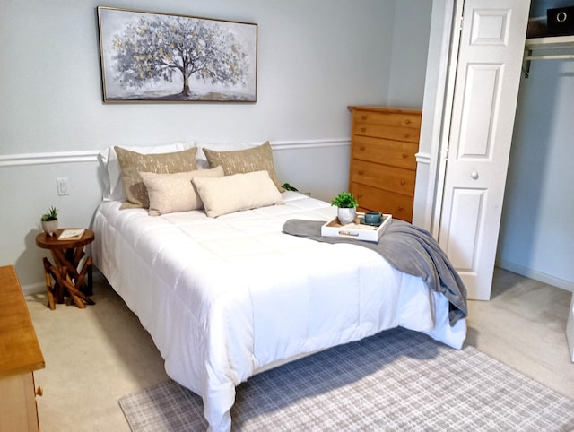 bedroom with carpet floors and baseboards