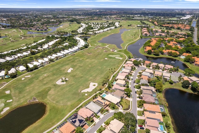 aerial view with a water view, golf course view, and a residential view