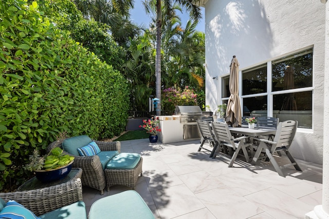 712 NE 71st St, Boca Raton, FL 33487 - view of patio with outdoor dining area and area for grilling
