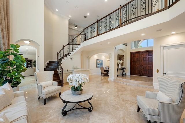 712 NE 71st St, Boca Raton, FL 33487 - interior space featuring recessed lighting, stairway, a towering ceiling, marble finish floor, and arched walkways