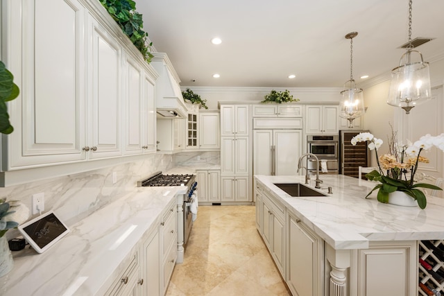 712 NE 71st St, Boca Raton, FL 33487 - kitchen featuring a sink, a large island, visible vents, premium appliances, and crown molding