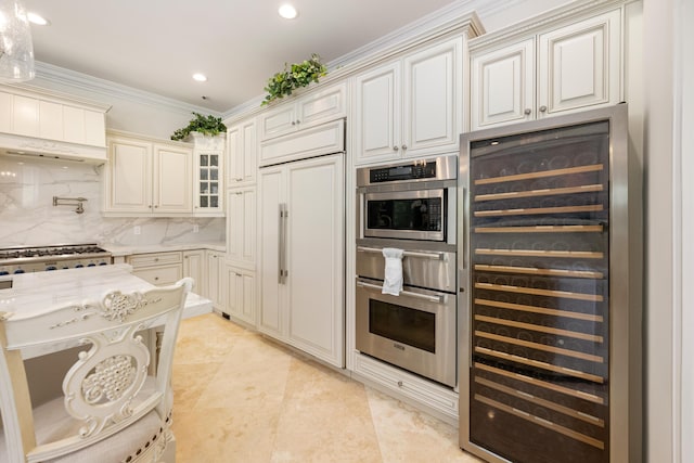 712 NE 71st St, Boca Raton, FL 33487 - kitchen featuring ornamental molding, recessed lighting, backsplash, wine cooler, and stainless steel appliances