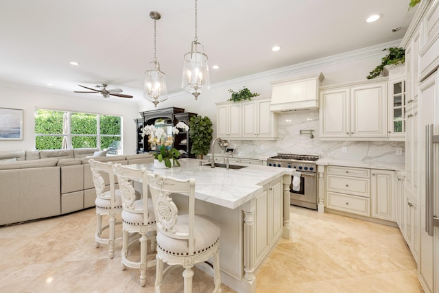 712 NE 71st St, Boca Raton, FL 33487 - kitchen with ornamental molding, a sink, premium range hood, light stone countertops, and stainless steel range