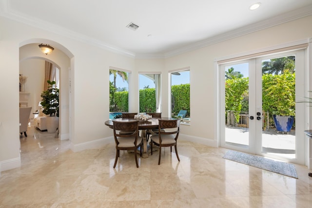 712 NE 71st St, Boca Raton, FL 33487 - dining space with visible vents, arched walkways, marble finish floor, and ornamental molding