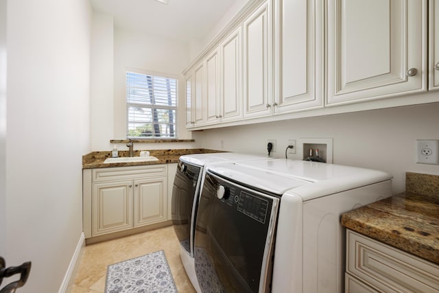 712 NE 71st St, Boca Raton, FL 33487 - clothes washing area with washing machine and clothes dryer, cabinet space, a sink, and baseboards