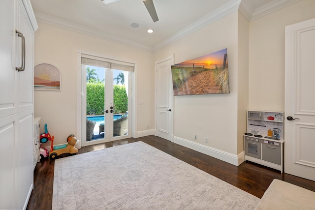 712 NE 71st St, Boca Raton, FL 33487 - playroom with dark wood finished floors, a ceiling fan, baseboards, and ornamental molding