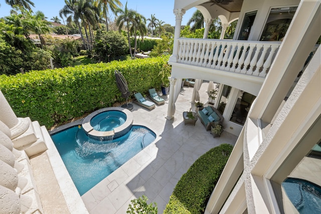 712 NE 71st St, Boca Raton, FL 33487 - view of pool with a patio and a pool with connected hot tub