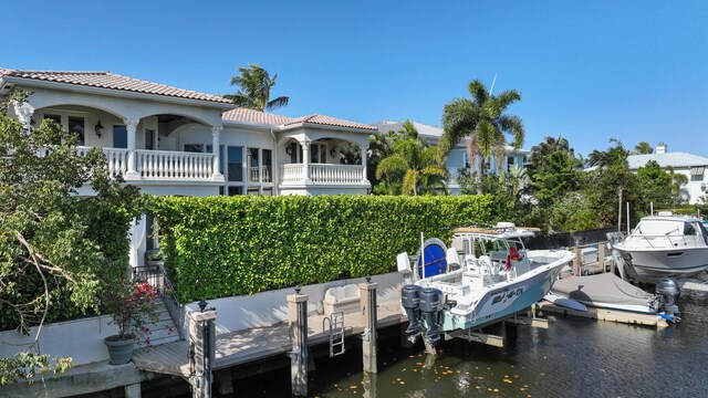 712 NE 71st St, Boca Raton, FL 33487 - dock area featuring boat lift and a water view